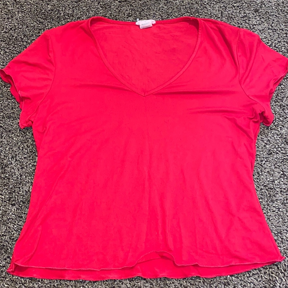 Red t shirt with v neck and slightly ruffled edges